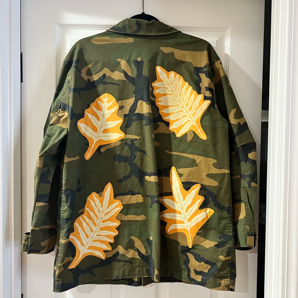 One of a kind. Camouflage Unisex with Hawaiian leaf print sewn on back. OS.
